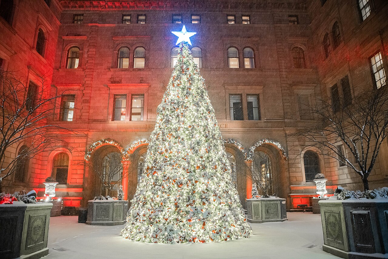 Snow-covered Christmas tree in the courtyard of Lotte New York Palace